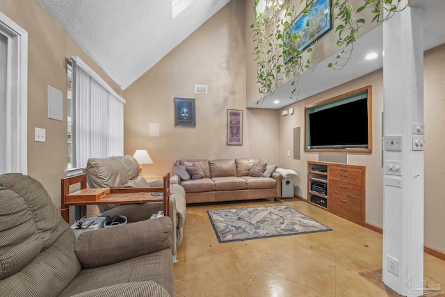 living room featuring high vaulted ceiling and a textured ceiling