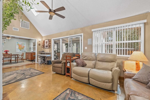 living room with a textured ceiling, high vaulted ceiling, and ceiling fan