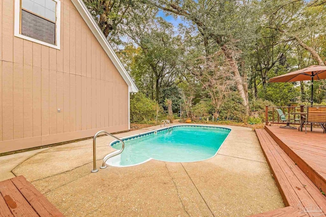 view of pool with a wooden deck