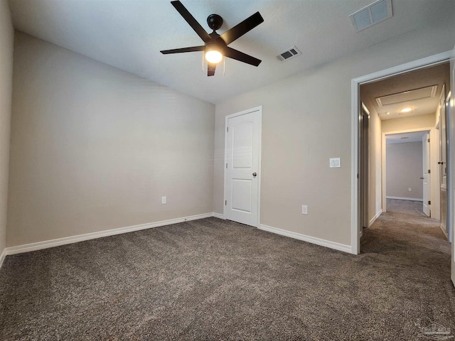 unfurnished bedroom featuring ceiling fan and dark colored carpet