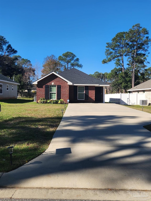 view of front of property featuring central air condition unit and a front yard