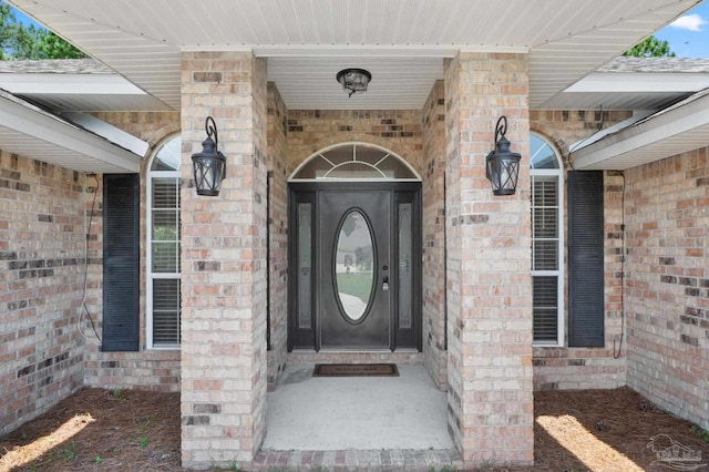 entrance to property with brick siding