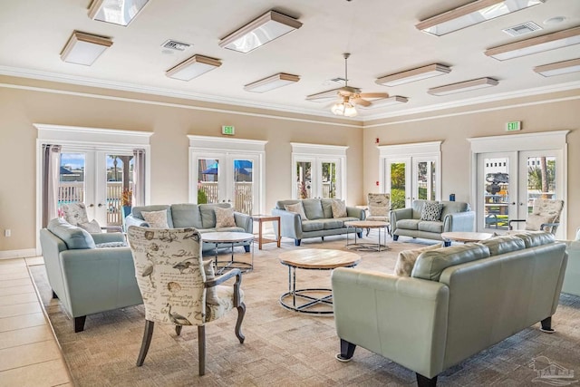 living room featuring french doors, light tile patterned flooring, crown molding, and ceiling fan