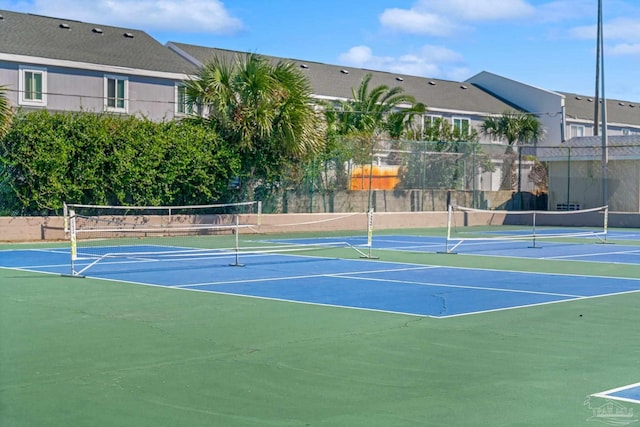 view of sport court with basketball hoop