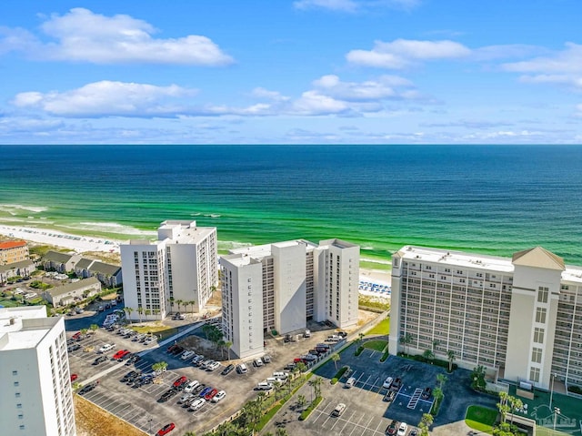 bird's eye view with a water view and a view of the beach