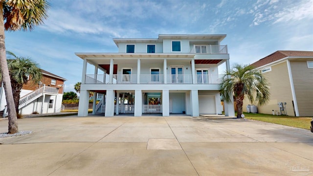 beach home with a carport and a garage