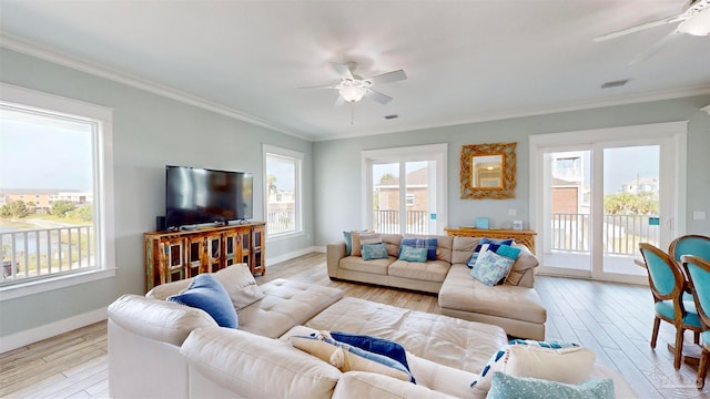 living room with light hardwood / wood-style floors and ornamental molding