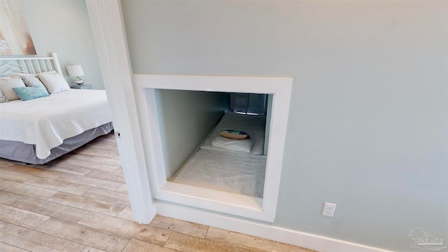 bedroom with light hardwood / wood-style flooring