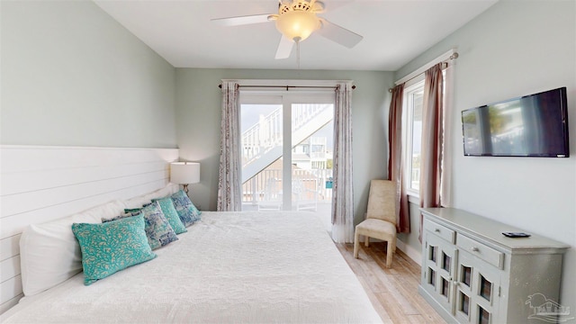 bedroom with ceiling fan and light wood-type flooring