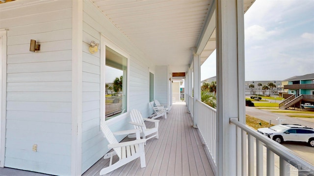 wooden terrace featuring a porch