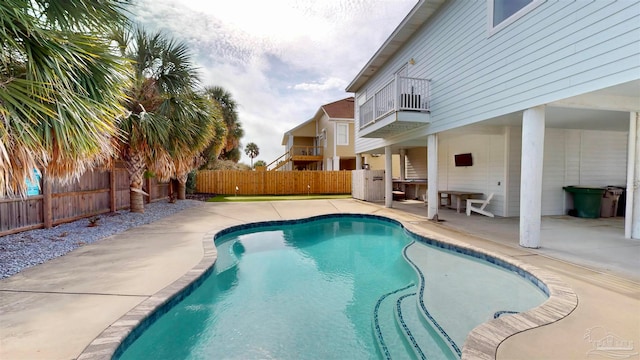 view of swimming pool featuring a patio area