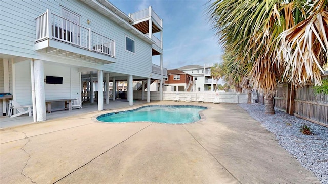 view of swimming pool with a patio