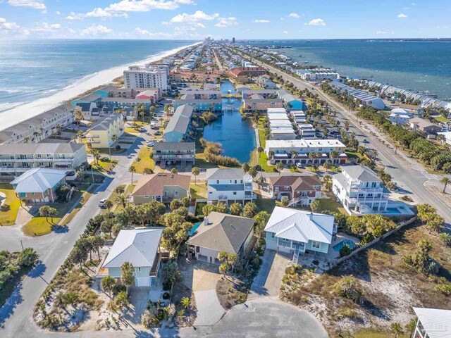 drone / aerial view with a water view and a view of the beach