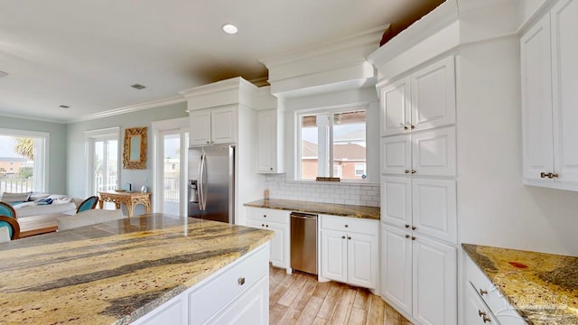 kitchen with white cabinetry, stone counters, and stainless steel refrigerator with ice dispenser