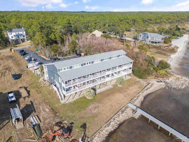 birds eye view of property with a wooded view