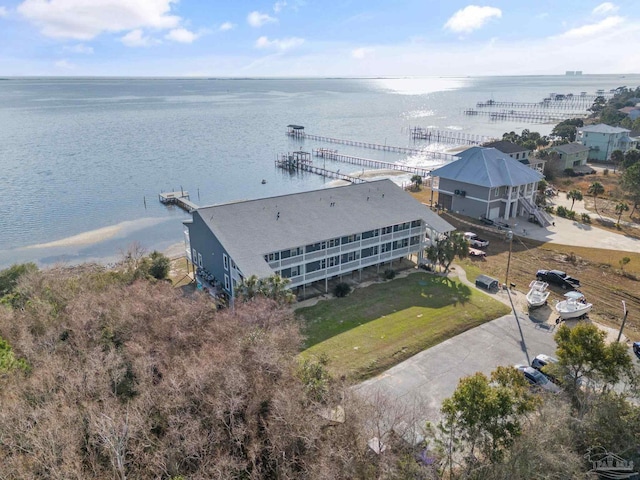 birds eye view of property with a water view