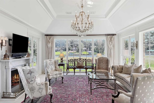 sunroom with a wealth of natural light and a chandelier