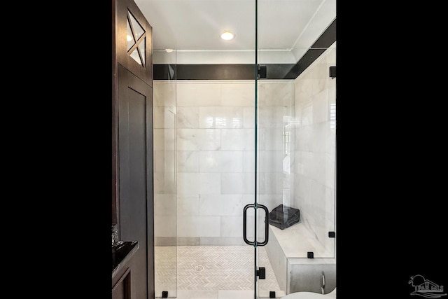 bathroom with a shower with shower door