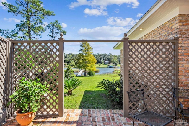 view of patio with a water view