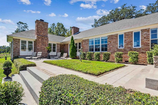 ranch-style home featuring a patio area and a front yard