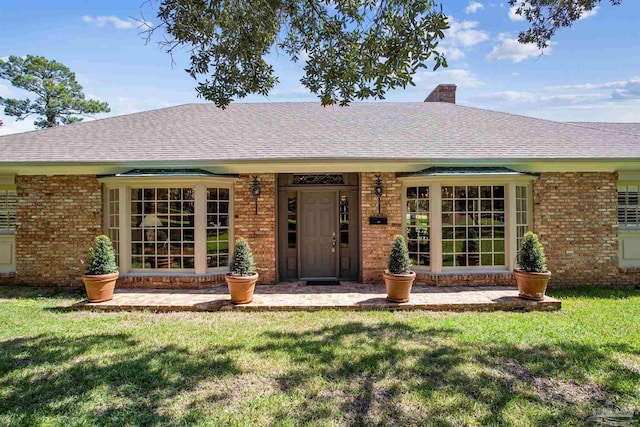 back of house with a yard