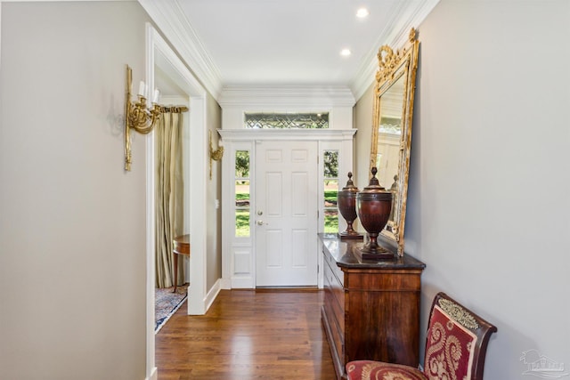 entryway with crown molding and dark hardwood / wood-style flooring