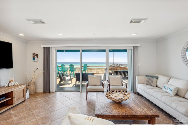 tiled living room with ornamental molding and a water view