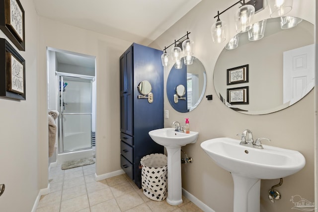 bathroom featuring tile patterned floors, baseboards, and a stall shower