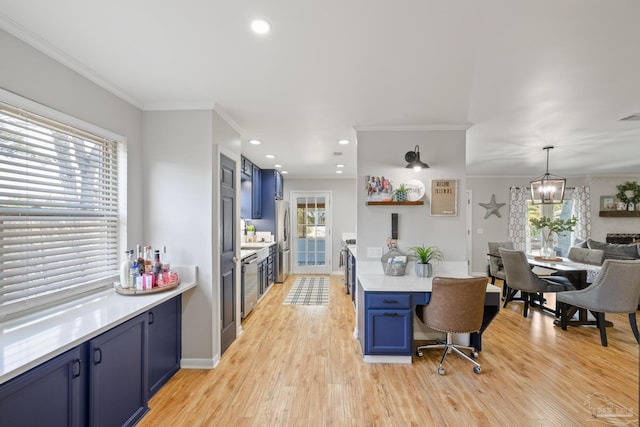 kitchen featuring blue cabinetry, light wood-style flooring, light countertops, and freestanding refrigerator