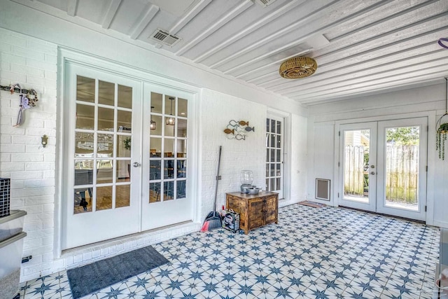 sunroom / solarium featuring french doors and visible vents