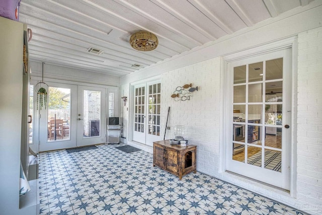 sunroom with visible vents and french doors