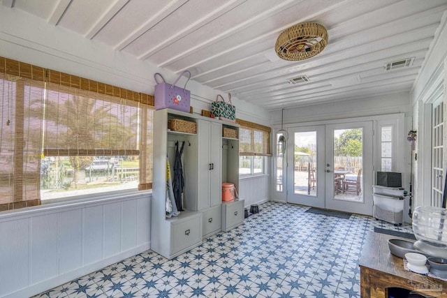 mudroom featuring french doors, visible vents, and light floors