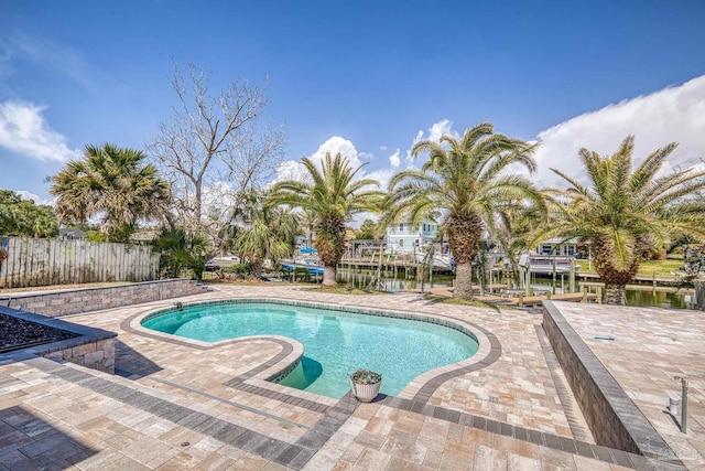 view of pool featuring a patio area, a fenced in pool, and fence