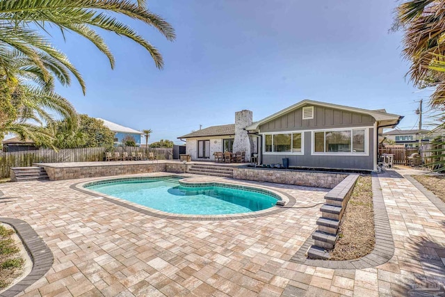 view of pool featuring a patio area, a fenced in pool, and a fenced backyard