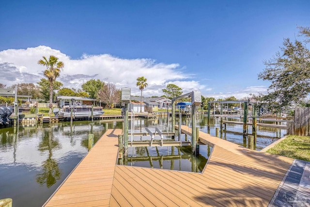 dock area featuring a water view and boat lift