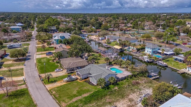 bird's eye view with a water view and a residential view