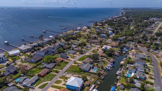 drone / aerial view with a residential view and a water view