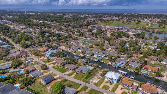 birds eye view of property with a residential view and a water view