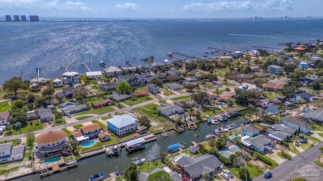 bird's eye view featuring a residential view and a water view