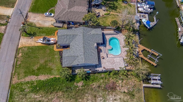 birds eye view of property with a water view