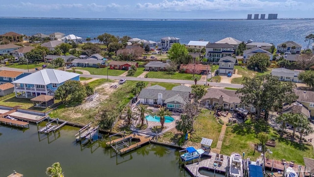 birds eye view of property featuring a residential view and a water view