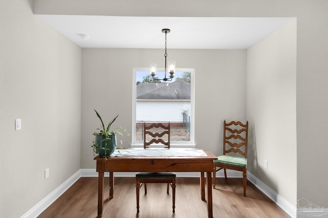5681 Paddlewheel Dr, Milton, FL 32583 - sitting room featuring a chandelier, light wood-style floors, and baseboards