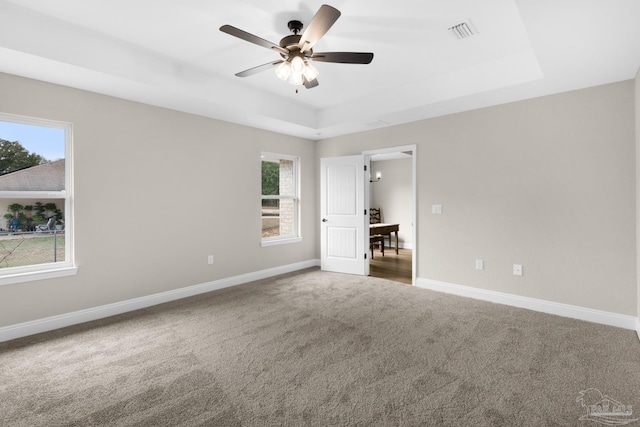 5681 Paddlewheel Dr, Milton, FL 32583 - carpeted spare room with a raised ceiling, healthy amount of natural light, ceiling fan, and baseboards