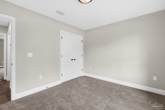 5681 Paddlewheel Dr, Milton, FL 32583 - unfurnished room with dark colored carpet and baseboards