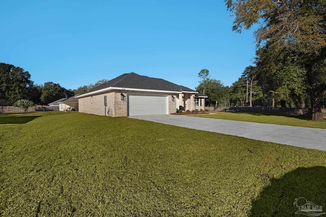 5681 Paddlewheel Dr, Milton, FL 32583 - view of side of home featuring an attached garage, brick siding, and driveway