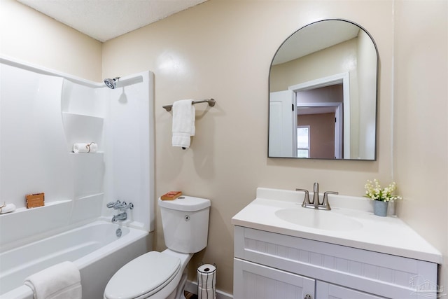 full bathroom featuring toilet, vanity, a textured ceiling, and  shower combination