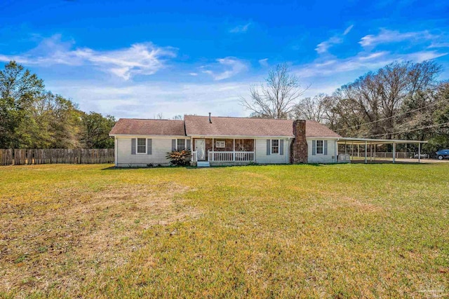 back of property featuring a carport, a yard, a porch, and fence