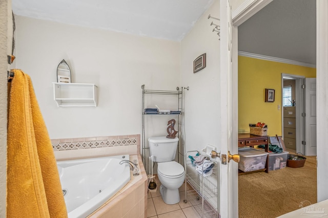 bathroom featuring toilet, ornamental molding, a jetted tub, and tile patterned floors