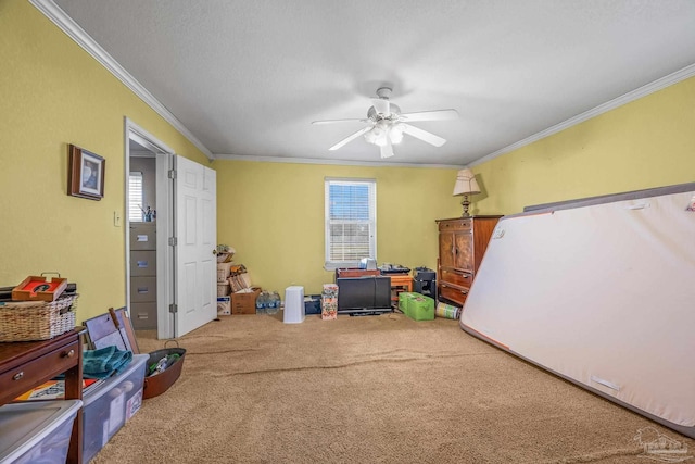 interior space with crown molding, ceiling fan, a wealth of natural light, and carpet flooring