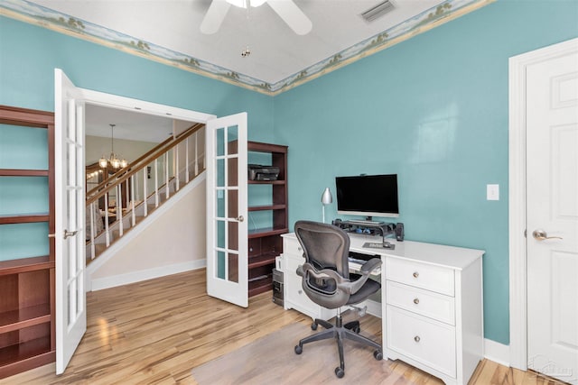 office featuring french doors, light wood-type flooring, visible vents, and an inviting chandelier